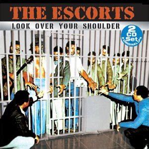 The escorts look over your shoulder Features Song Lyrics for The Escorts's Look Over Your Shoulder & Other Favorites (Live) album